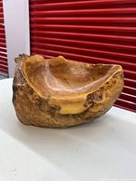 Front view showing carved interior and burl grain