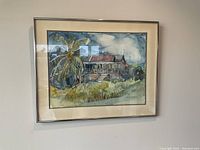 Full view of framed watercolor painting showing the house, palm tree and landscape in Barbados.