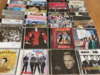 Photo showing various CDs including Radiohead, Culture Club, Sting, David Bowie, No Doubt, Jamiroquai, Queen, Peter Gabriel.