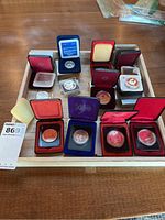 Tray with five presentation boxes for commemorative Canadian silver dollars