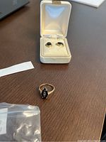 Ring and earrings displayed together in jewelry box