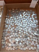 Overview of mixed Canadian silver coins in tray