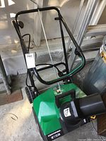 Overview shot showing entire snow thrower