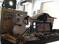 Wagner PaintREADY sprayer with box visible in background alongside hand tools and ratchet set.