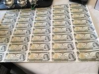 Full uncut sheet of $1 bills laid flat.