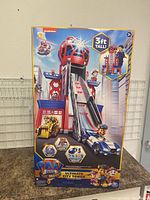 Boxed Paw Patrol Ultimate City Tower playset, showing front of packaging with playset, vehicles and characters.