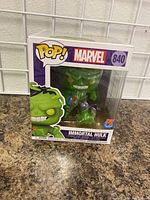 Front view of Immortal Hulk Funko Pop figure in original box showing figure and labels.