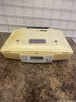 Front view of the beige Sony kitchen CD player and radio, showing control panel and display.