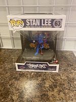 Front view of boxed Stan Lee #63 Funko POP figure from the Street Art Collection Deluxe series, new and sealed in packaging with Target exclusive sticker.