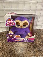 Front view of boxed Zuru Pets Alive Fifi the Sloth plush toy showing branding and packaging