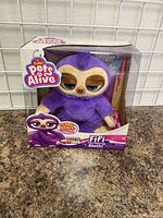 Front view of new in box Zuru Pets Alive Fifi The Interactive Sloth toy in original packaging.