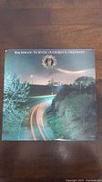 Front cover of the Bachman Turner Overdrive 'Freeways' album depicting a nighttime highway scene with light trails and trees