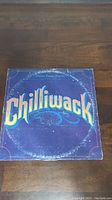 Front of album cover with 'Chilliwack' in large yellow letters on blue background.