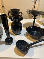 Photo showing all six black Depression glass items on table