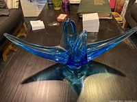 Front perspective showing full abstract winged shape on tabletop