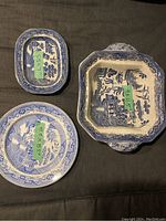Top view of the two round plates and square bowl with size labels