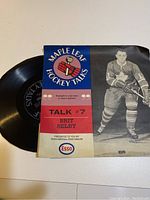 Flexi disc partially visible with colorful sleeve showing hockey player and Maple Leafs Hockey Talks branding.