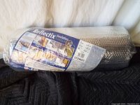 Overall view of Reflectix insulation in original packaging showing label and rolled product