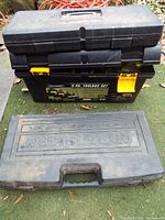 Two black toolboxes: a Craftsman branded professional case and a 4-piece Dynamo toolbox set with yellow latches and removable tray.