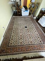 Full view of entire rug in room showing overall pattern and size