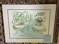 Full view of the framed watercolor artwork showing buildings and lush hanging greenery, signed B. Birdsey.