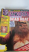 Close-up of Fangoria magazine cover featuring 'Dead Heat' with blood and horror character