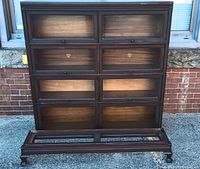Front view of assembled bookcase with eight glazed compartments