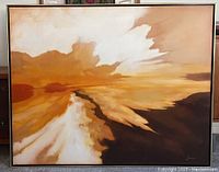 Full view of the framed painting showing the abstract sunset imagery and gold wood frame