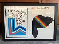 Both framed posters side by side showing 1980 Lake Placid Winter Olympics and 1976 Montréal Summer Olympics artwork.
