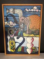 Full view of painting in thin oak frame