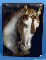 Front view of Sid Dickens Memory Block showing white horse on dark background