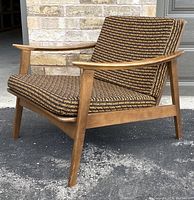 Three-quarter right-side view of lounge chair showing frame and upholstery pattern