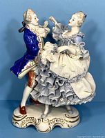 Full front view of porcelain dancing couple on scalloped base