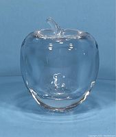 Crystal apple-shaped jar, clear with curved stem lid, front and side view