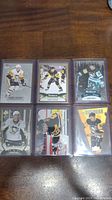 Six Sidney Crosby hockey cards laid out in two rows of three each showing various card designs and Crosby in Penguins jerseys.