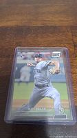 Matt Brash rookie baseball card in protective plastic case on wooden surface.