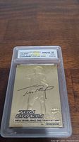Front of Tom Brady 2000 Fleer Ultra 23kt Gold Rookie Card showing autograph and grading label WCG 10 GEM-MT.