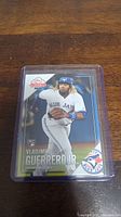 Front view of Vladimir Guerrero Jr. rookie baseball card in protective plastic holder.