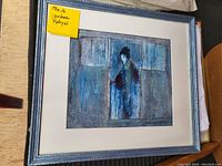 Framed artwork with figure in blue tones, signed and numbered by Darlene Robyn.