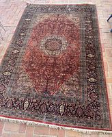 Top-down view of entire rug laid flat on brick floor