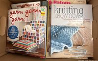Top view of knitting books including 'Yarn, Yarn, Yarn' and 'Knitting Know-How'.