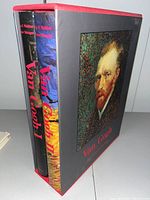 Photo showing two hardcover Van Gogh books (Volume 1 and Volume 2) housed in a slipcase with Van Gogh's portrait.