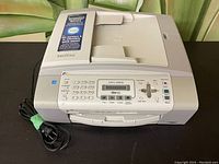 Front angle view of Brother MFC-290C inkjet multifunction printer showing full device and control panel with attached power cord.