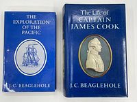 Front covers of the two blue hardcover books with dust jackets; titles and author clearly visible.