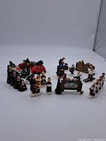 Photo showing entire lot of vintage Christmas figurines from The Original Snow Village collection, including characters and decorative pieces.