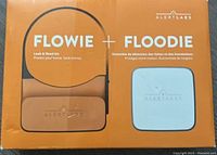 Front of box showing Flowie + Floodie leak and flood kit by Alert Labs in orange and white packaging.