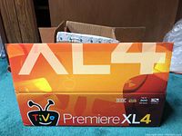Closed box of TiVo Premiere XL4 DVR showing branding and model info.
