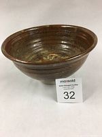 Angled view of Bob Kingsmill grey stoneware bowl showing the interior glaze and shape.