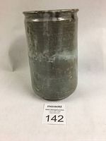 Front view of tall grey stoneware vase with some wear at base.