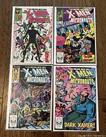 Four comic issues of The X-Men and the Micronauts from 1983 laid out together, bags and boards visible, showing front covers.